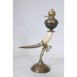 Antique oil lamp with horn body and brass mounts and reservoir, 60cm high