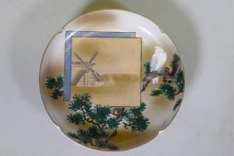 A Japanese Meiji period shallow porcelain bowl, with raised enamel decoration of a dove in a cypress