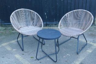 A pair of contemporary faux cane garden chairs and matching occasional table