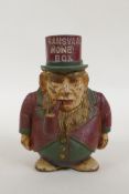 An antique painted cast iron 'Transvaal Money Box' in the form of a caricatured President Kruger,