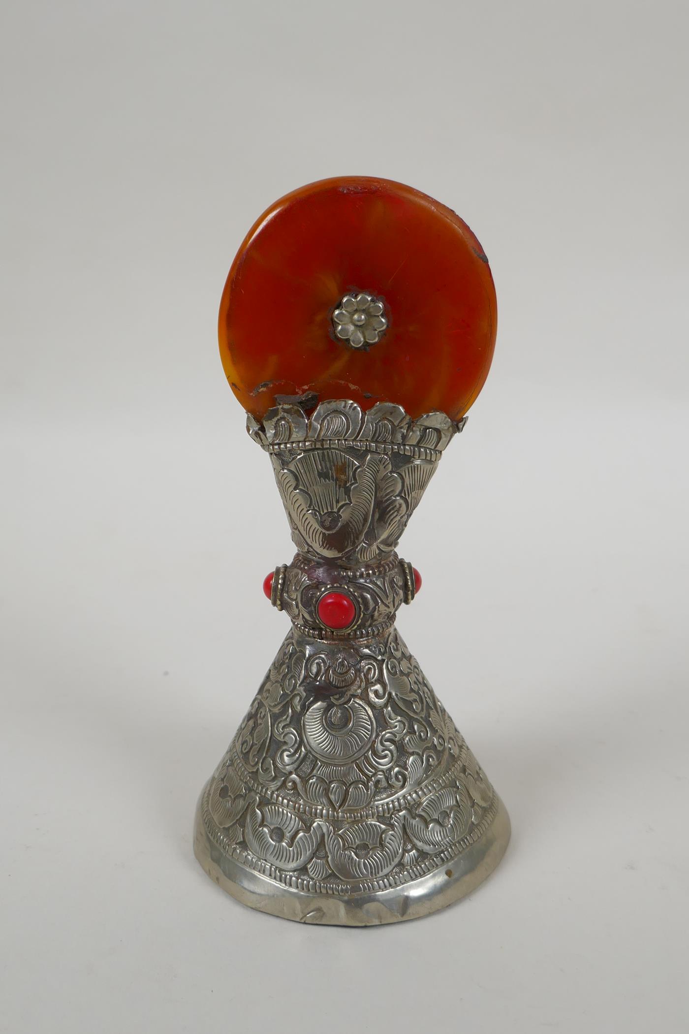 A Tibetan white metal temple seal set with a faux amber rondel, 16cm high - Image 2 of 3