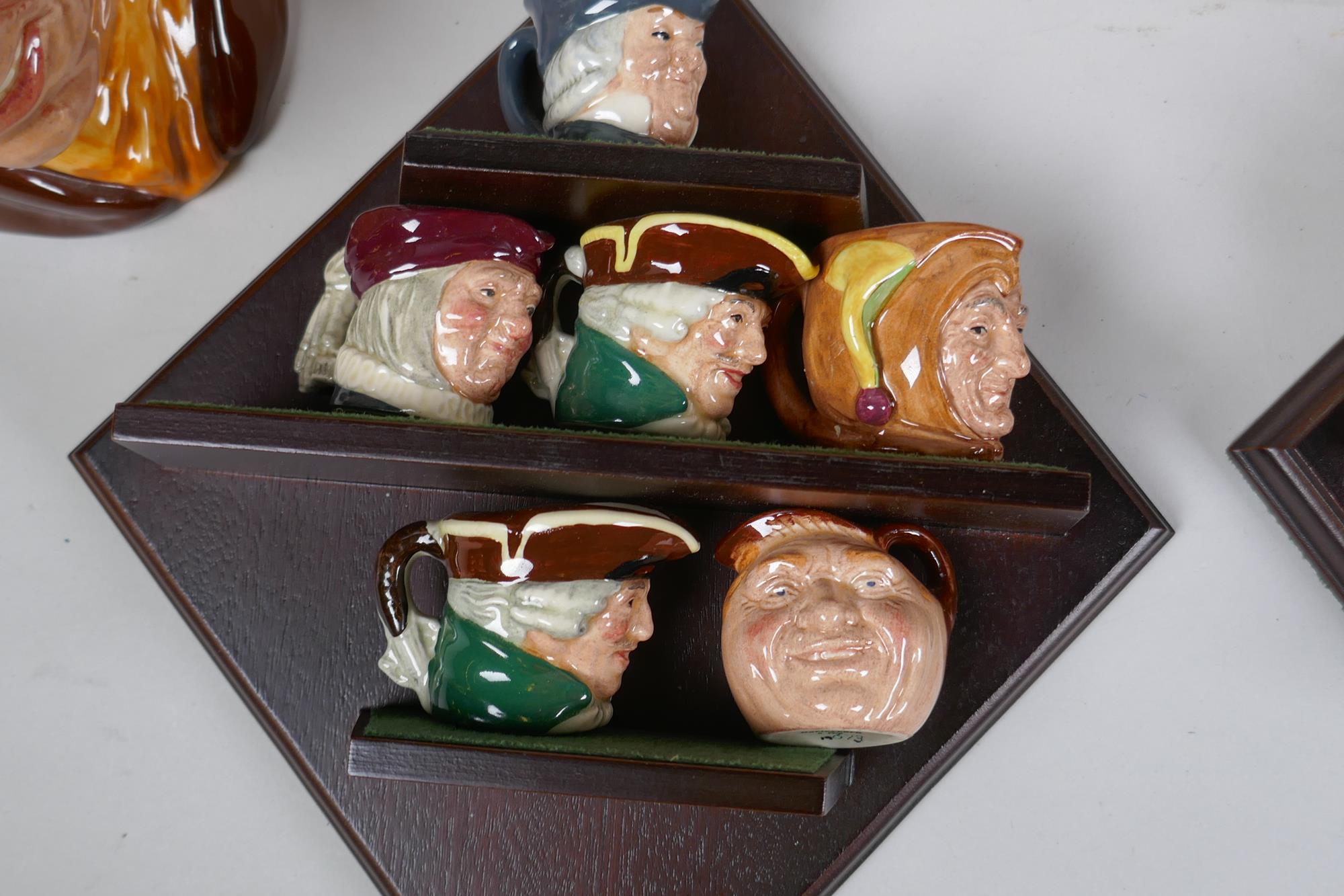 A set of six Royal Doulton mask jugs and twelve miniature jugs with display shelves - Image 6 of 6