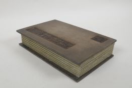 A Chinese wood and silk bound book containing amber hardstone tablets with chased and gilt character