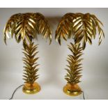 A pair of gilt metal table lamps in the form of palm trees, 71cm high