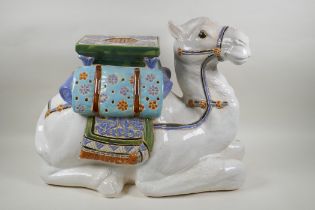 A Chinese ceramic garden seat in the form of a camel, 60cm long, 45cm high
