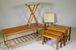 A 1970s teak coffee table with magazine rack, a nest of three 70s/80s occasional tables and two