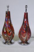 A matched pair of Murano glass style table lamps, with swirled decoration and chromed bases, 55cm