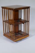 Inlaid yew wood veneered revolving bookcase, 50 x 50 x 80cm