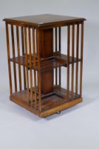 Inlaid yew wood veneered revolving bookcase, 50 x 50 x 80cm