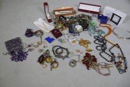 A quantity of costume jewellery, silver rings, jade pendant necklace, uncut amethysts gem stones,