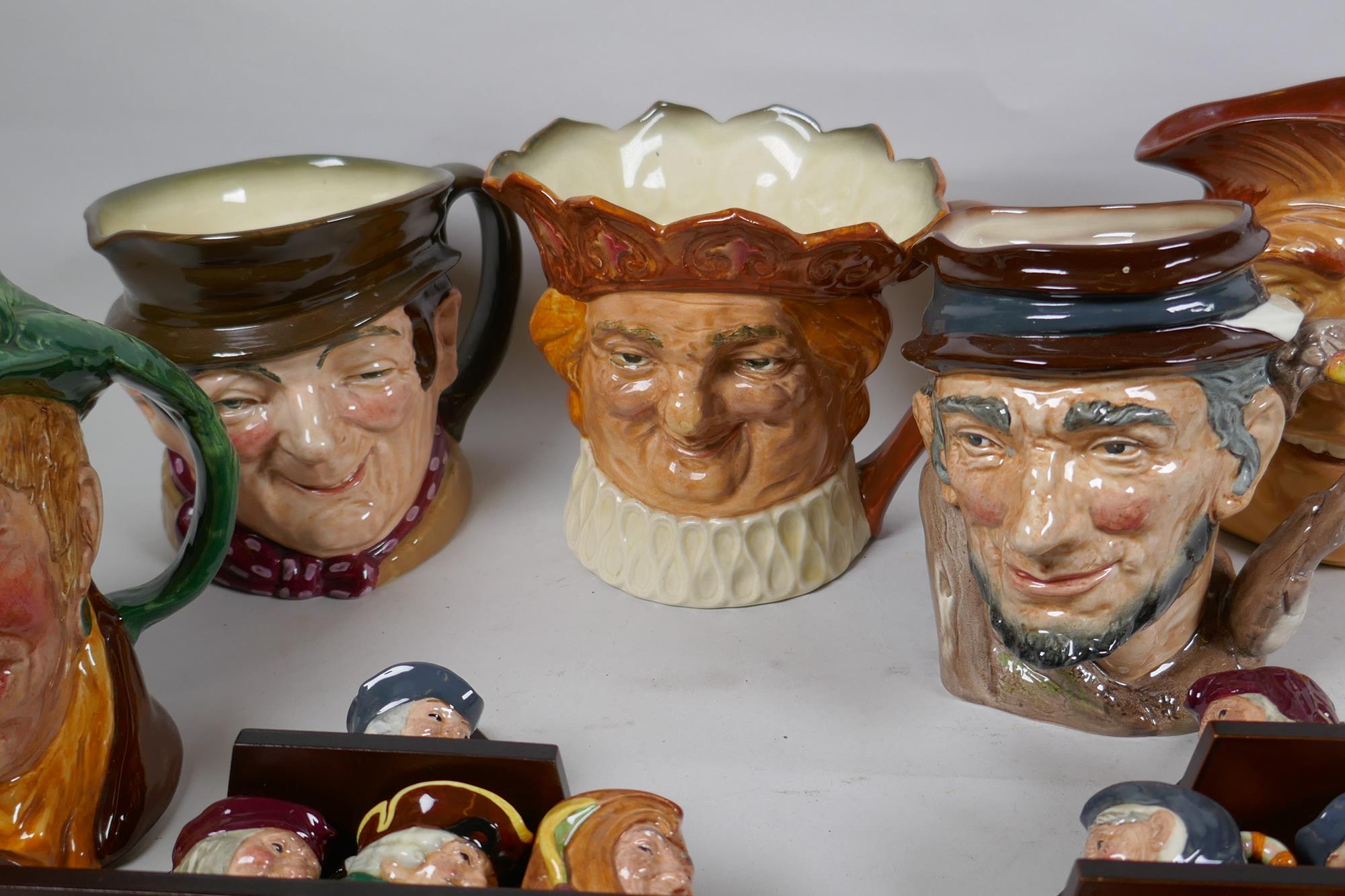 A set of six Royal Doulton mask jugs and twelve miniature jugs with display shelves - Image 3 of 6