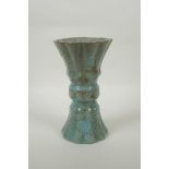 A Chinese celadon crackle glaze gu shape vase of ribbed form, 23cm high