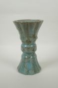 A Chinese celadon crackle glaze gu shape vase of ribbed form, 23cm high