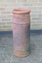 A terracotta chimney pot, 75cm high, 29cm diameter