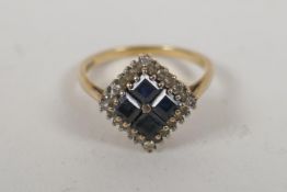 An antique 9ct gold square headed dress ring set with white sapphires and tanzanite, size O