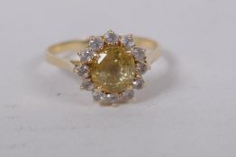 14ct gold ring set with central yellow sapphire surrounded by white sapphires, size N/O