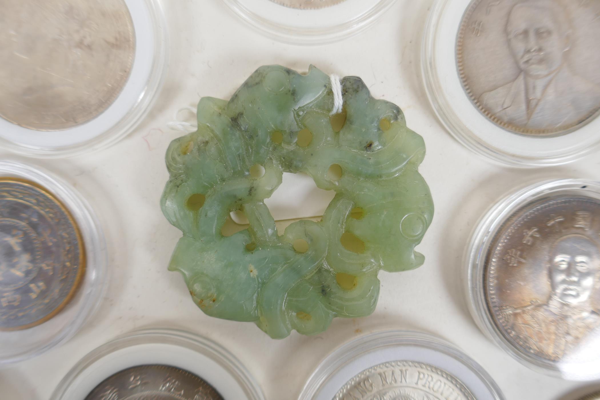 A Chinese carved and pierced mottled green jade pendant with entwined carp decoration, 6cm diameter, - Image 4 of 6