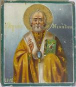 An antique St Nicholaos Greek Orthodox icon, hand painted on a wood panel with gilt highlights,