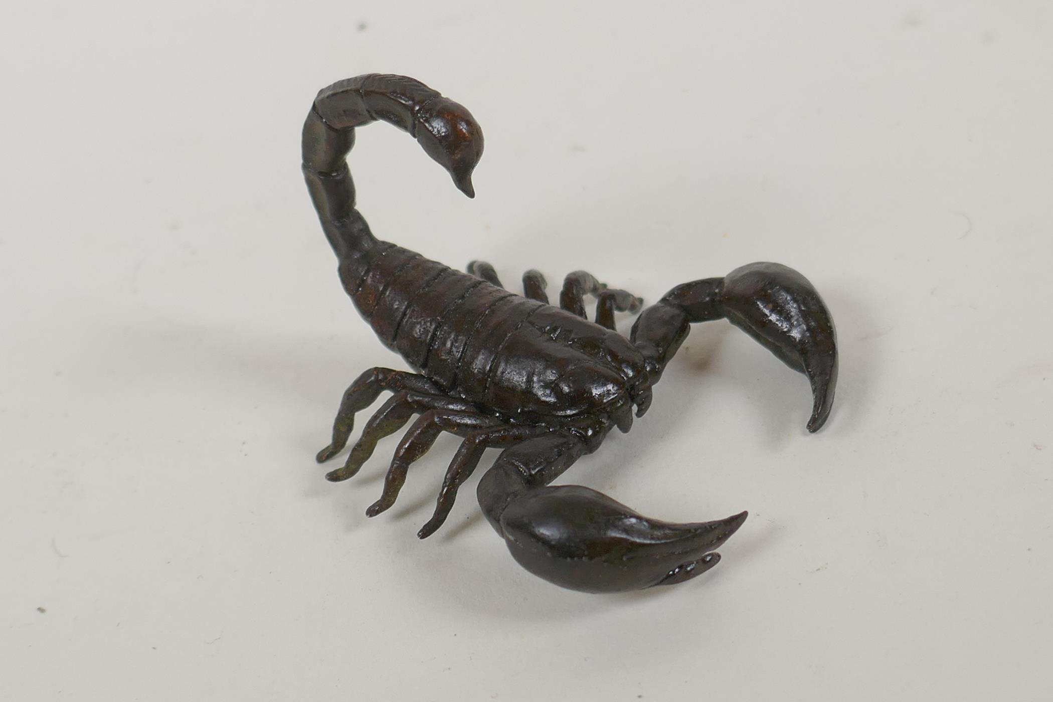 A Japanese style bronze okimono scorpion, indistinct mark to base, 5cm long - Image 2 of 3