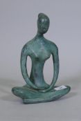 A contemporary bronze figure of a seated nude, 27cm high, unsigned