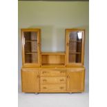 A mid century Ercol elm Windsor high back sideboard/display cabinet, with glazed upper section,