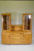 A mid century Ercol elm Windsor high back sideboard/display cabinet, with glazed upper section,