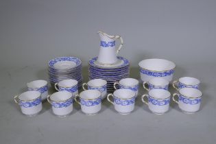 A Royal Worcester twelve place porcelain tea set with blue transfer and gilt decoration, pattern no.