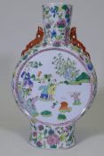 A Chinese famille verte ceramic moonflask, decorated with boys playing in a garden, 45cm high