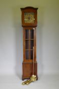 An early mahogany case longcase clock with glazed door and brass and silvered dial, the movement