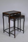 A nest of two C19th Chinese hardwood side tables with pierced friezes and shaped supports, 45 x 31 x