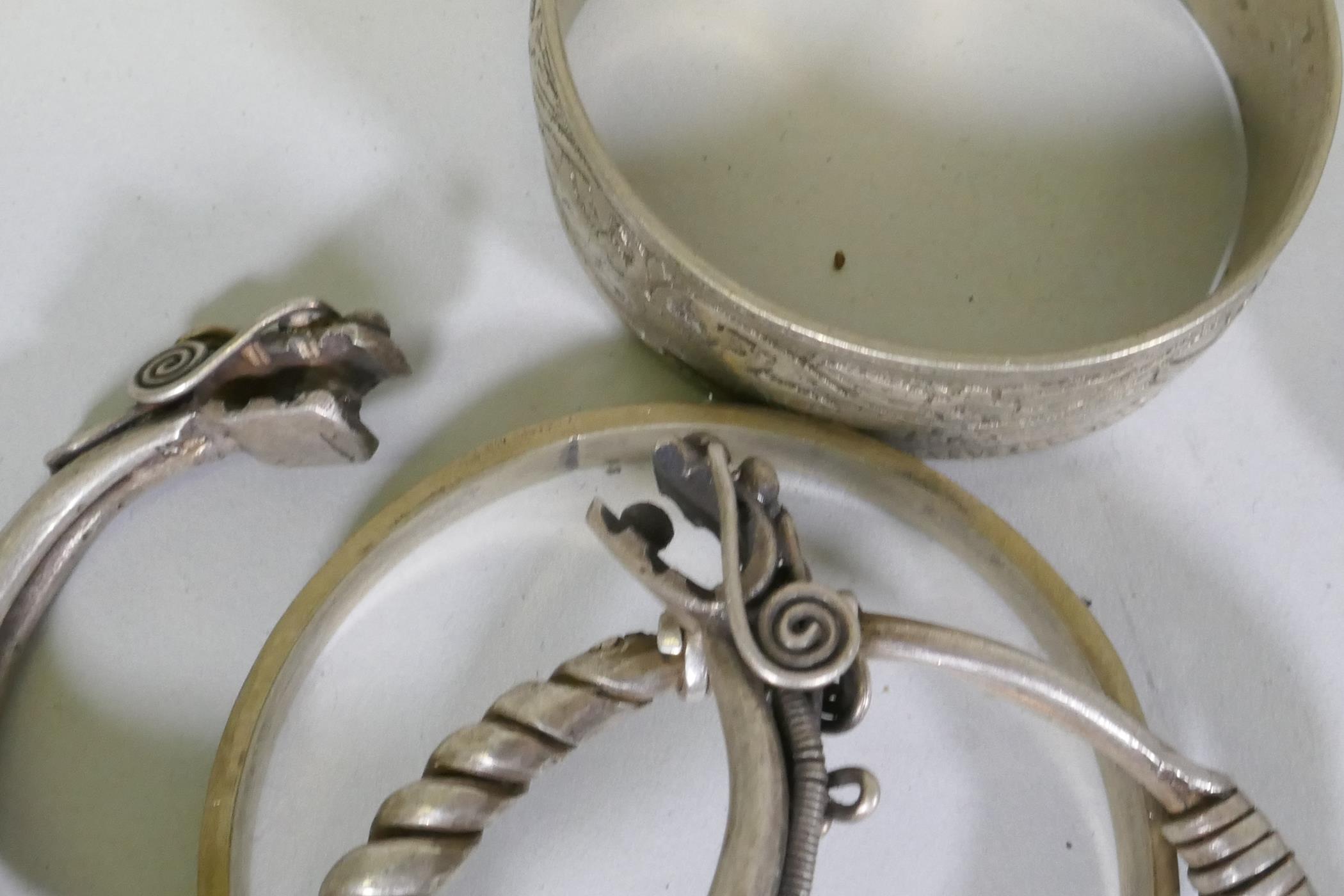 A collection of Afghan white metal bangles, set with paste stones, bidri style decoration, a Chinese - Image 4 of 6
