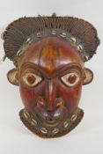 A West African Bamileke wood mask, 28 x 36cm