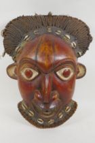 A West African Bamileke wood mask, 28 x 36cm