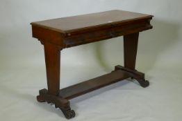 C19th mahogany writing table with two moulded frieze drawers, raised on end supports united by a