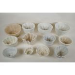 Twelve Victorian pottery jelly moulds of various sizes and shapes, largest 15cm high