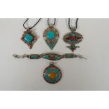 A Tibetan white metal bracelet set with turquoise and coral shards, together with four similar