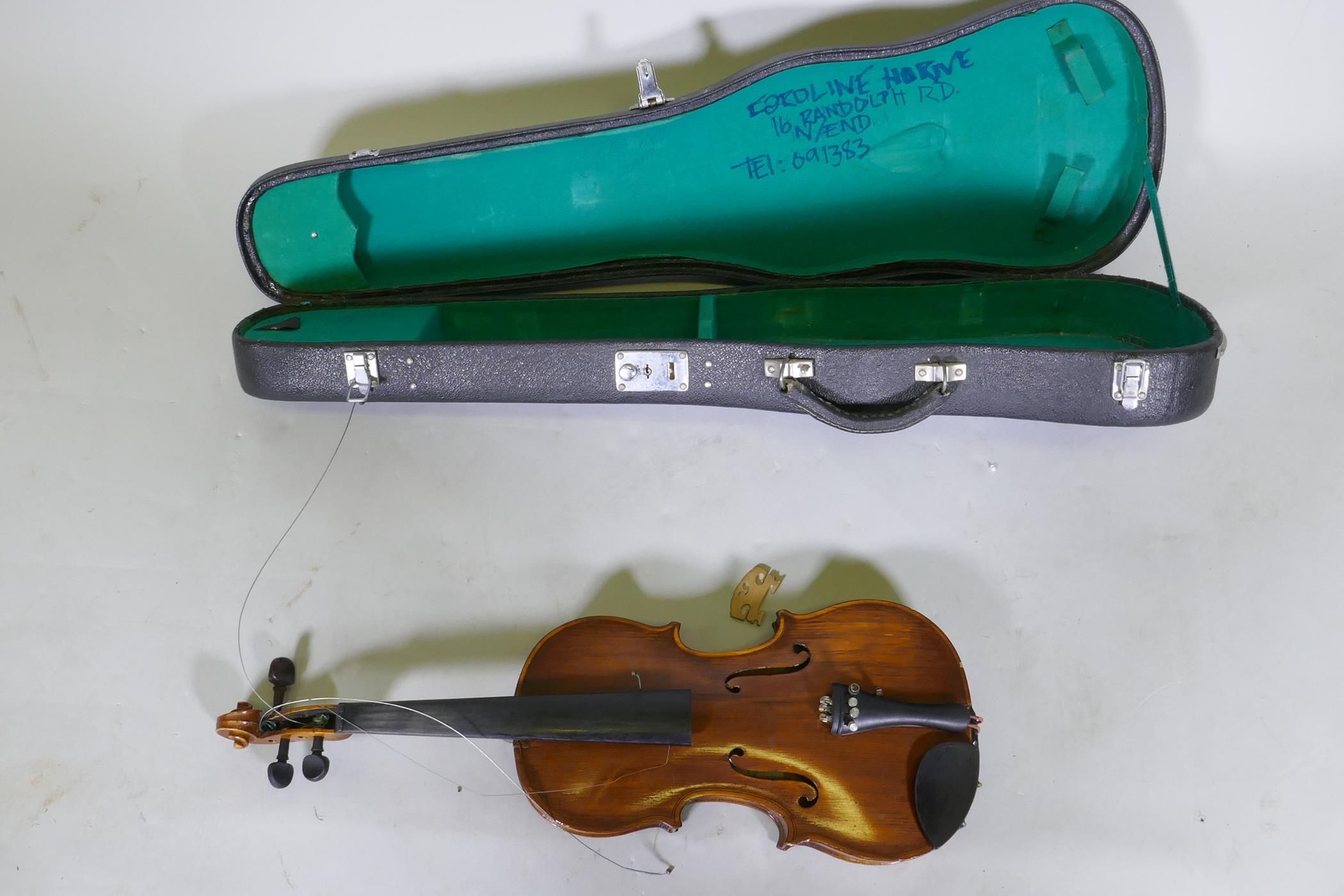 A violin in case, AF repaired