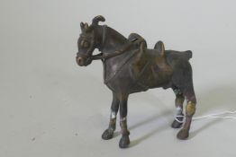 An Eastern bronze figure of a horse with saddle, 10cm high