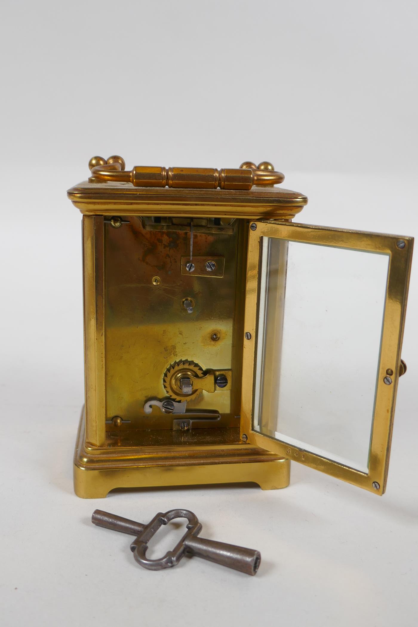 A brass cased carriage clock, the enamel dial with Roman numerals, 8 x 6cm, 11cm high - Image 3 of 4