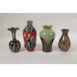 A collection of four oriental porcelain vases exhibiting unusual glazing techniques, largest 19cm