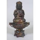 An oriental bronze censer in the form of a lotus with Buddivistic figure 24cm high