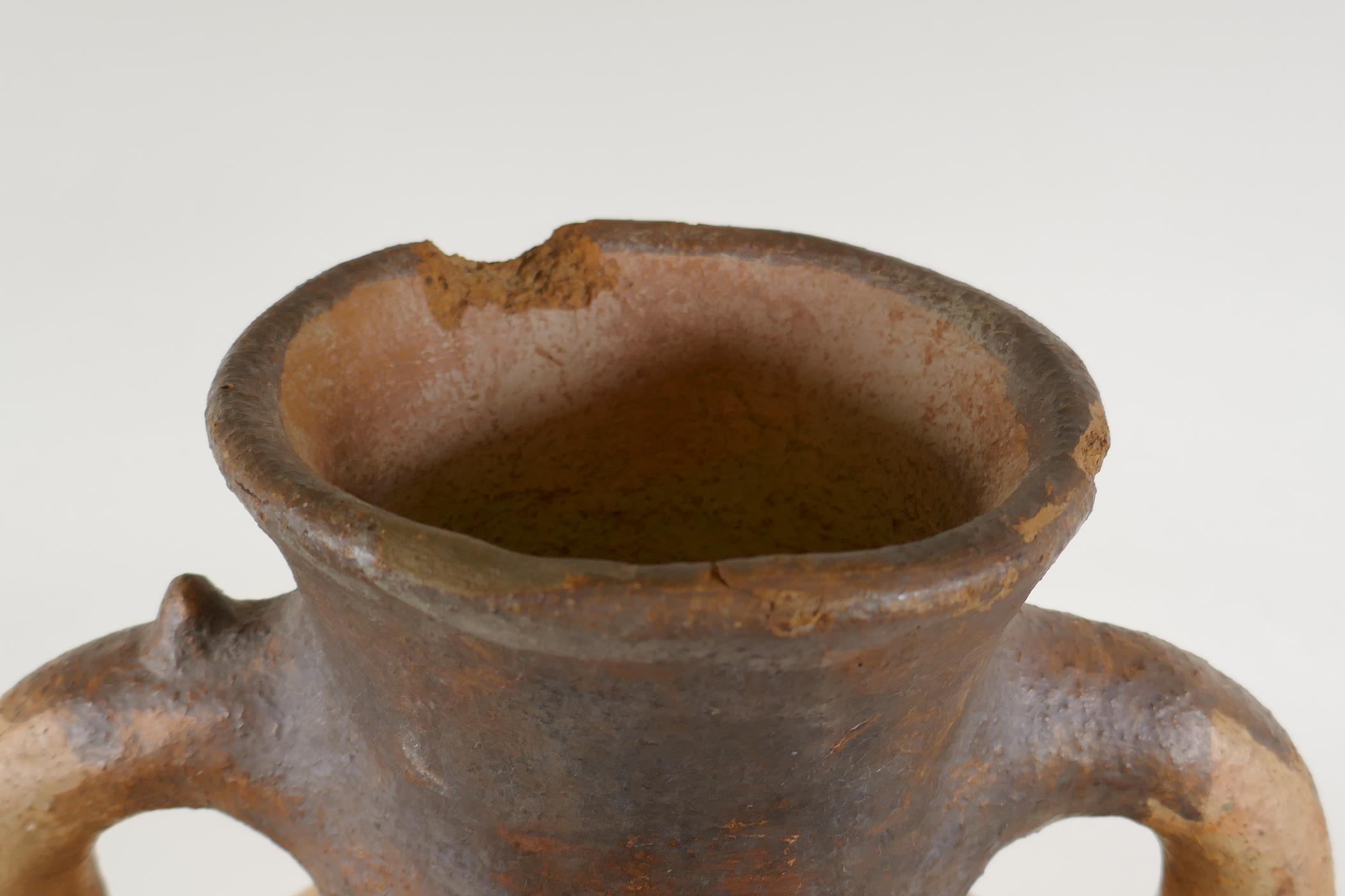 An antique North African terracotta amphora with two handles and hand painted design, AF, 63cm high - Image 5 of 6