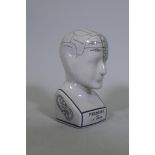 A ceramic phrenology head, 24cm high