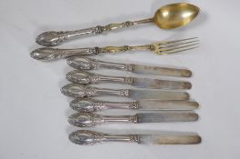Six French silver butter knives with filled handles, marked Cosson Corby, and matching salad