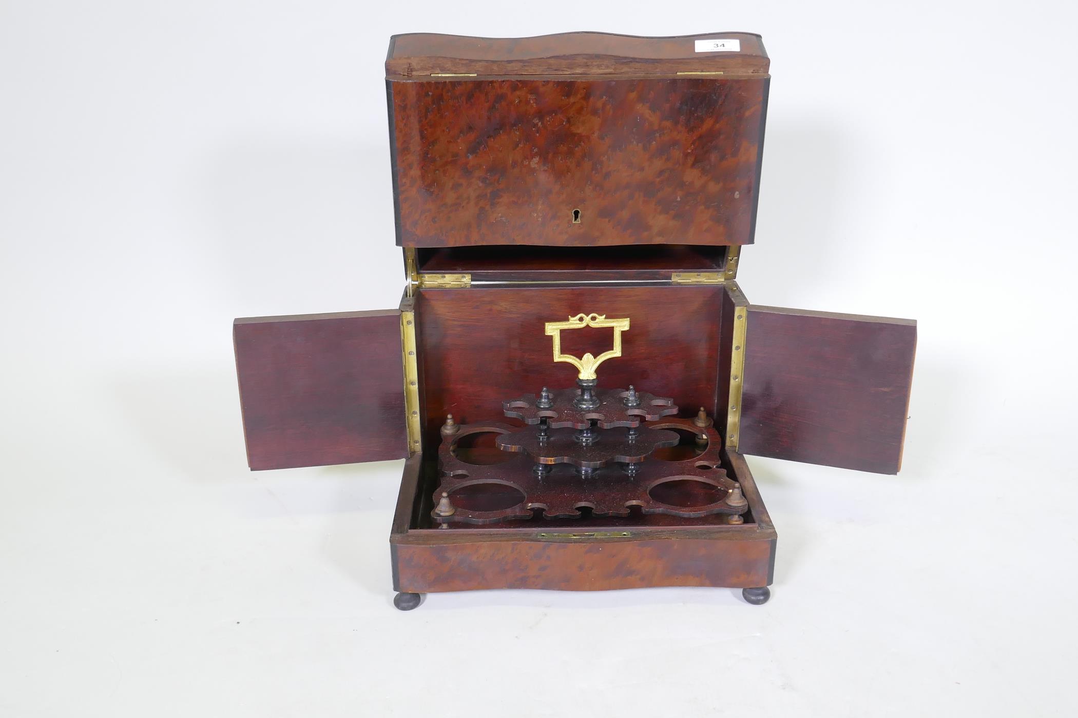 A C19th amboyna and ebony serpentine front decanter case, the lift up top and fold out sides opening - Image 2 of 5