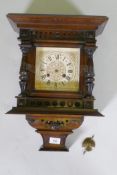 A late C19th/early C20th Black Forest wall clock, the Junghans movement striking on a gong, case AF,