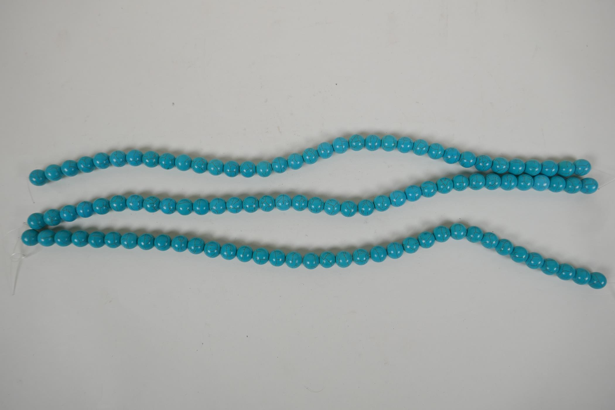 Three strings of turquoise beads, 42cm long