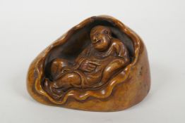 A Chinese soapstone seal with carved Lohan decoration, 10 x 7cm