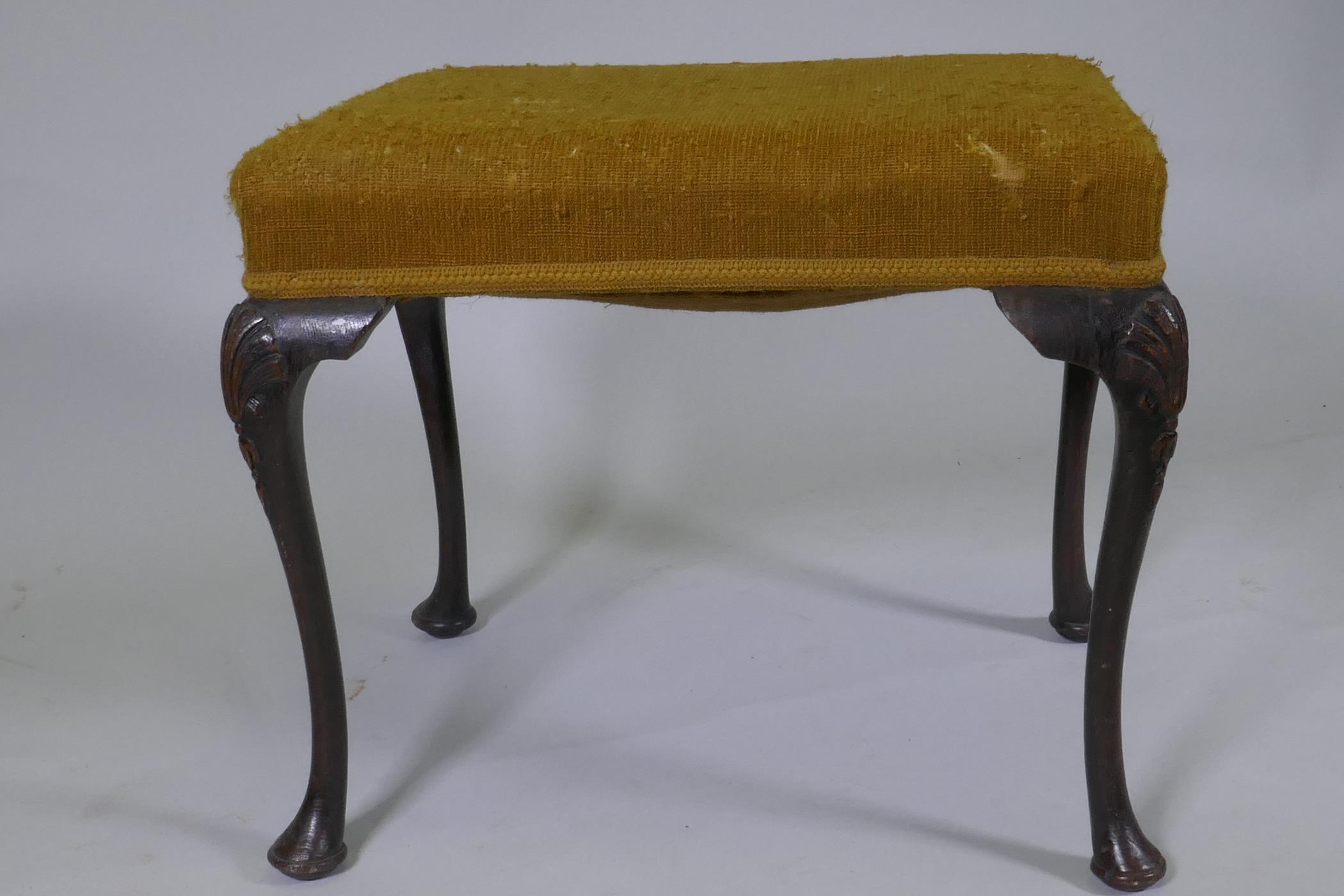 A Georgian style oak footstool, raised on cabriole supports with carved palm and harebell - Image 2 of 4