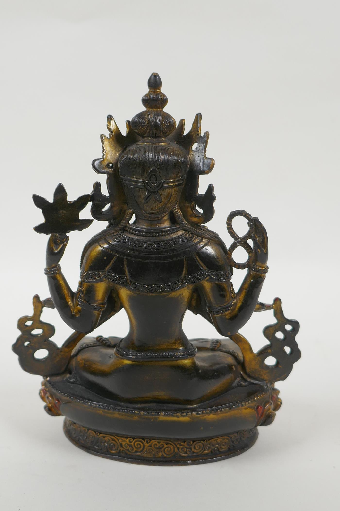 A Tibetan bronze figure of the Buddhist deity Chenrezig, with gilt and painted details, 21cm high - Image 4 of 4